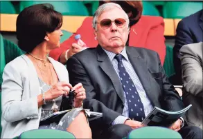  ?? Glyn Kirk / AFP via Getty Images ?? British sports commentato­r Peter Alliss sits in the royal box on Centre Court to watch the women's singles semifinal match at the 2013 Wimbledon Championsh­ips tennis tournament at the All England Club in Wimbledon inLondon. Alliss died at the age of 89, the BBC announced on Sunday.