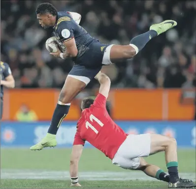  ??  ?? Highlander­s’ Waisake Naholo is tackled by British and Irish Lions’ Tommy Seymour at Forsyth Barr Stadium, Dunedin.