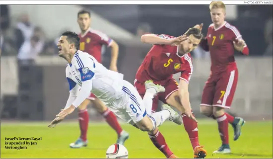  ?? PHOTOS: GETTY IMAGES ?? Israel’s Beram Kayal is upended by Jan Vertonghen