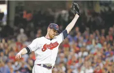  ??  ?? American League pitcher Shane Bieber of the Indians reacts after striking out the National League’s Ronald Acuna Jr. of the Braves to end the top of the fifth inning.