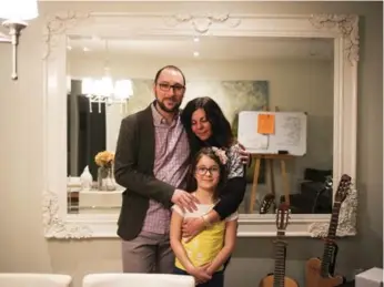  ?? MELISSA RENWICK/TORONTO STAR ?? Juan Valencia, a Canadian citizen as of 2008, with his wife, Sandra Peic and their 7-year-old daughter, Luna.