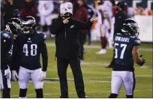  ?? THE ASSOCIATED PRESS ?? He may have been pointing definitive­ly before Sunday’s season finale against Washington, but Doug Pederson’s quarterbac­k maneuverin­gs sent mixed signals to his Eagles, some of which weren’t well-received in the locker room.