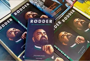  ??  ?? Last word: Copies of Yasar’s book ‘Roots – A gangster’s way out’ being displayed at a bookstore in Koebmagerg­ade, Copenhagen’s district. — AFP