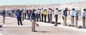  ?? DEAN HANSON/JOURNAL ?? Nearly a hundred competitor­s took to the firing line in 2012 during the revolver competitio­n of the NRA National Police Shooting Championsh­ip at Shooting Range Park.