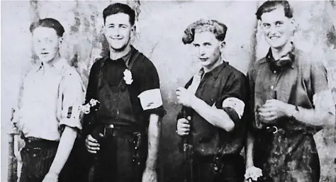  ??  ?? Courage: A group of Fighting French proudly wear their armbands as they pose for the cameras