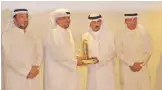  ??  ?? KUWAIT: Executive Manager Group Public Relations and Media at KFH Yousef Al-Ruwaieh receiving honor from KFSD’s Director General Lieutenant General Khaled Al-Mikrad.