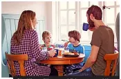  ?? ?? Chatting with your children around the table at mealtimes is one way to help them become more socially confident
