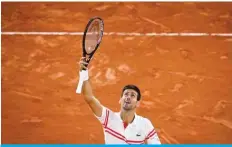  ?? AFP ?? PARIS: Serbia’s Novak Djokovic celebrates after winning against Spain’s Rafael Nadal at the end of their men’s singles semi-final tennis match on Friday. —