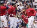  ?? ELISE AMENDOLA — THE ASSOCIATED PRESS ?? Boston Red Sox’s Rafael Devers, right, celebrates his threerun homer with J.D. Martinez, center, and Xander Bogaerts in the sixth inning of Thursday’s game against the Kansas City Royals in Boston.