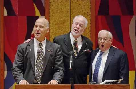  ?? Jessie Wardarski/Post-Gazette ?? Cantor Steven Stoehr of Chicago, left, joins Rabbi Jeffery Myers and Cantor Stephen Stein at Rodef Shalom’s Torah Mantle dedication ceremony in 2019. Mr. Stoehr has written a childen’s book about the 2018 Tree of Life shooting.