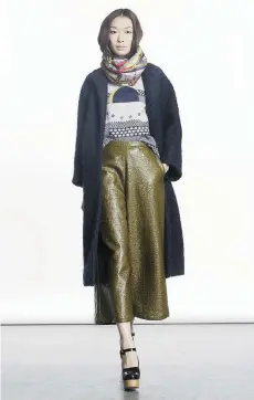  ??  ?? Outfit from New York designer Rachel Comey features cropped, wideleg laminated tweed pants in a metallic hue, with trail coat in Italian bouclé. The One of A Few boutique carries a selection of the line.