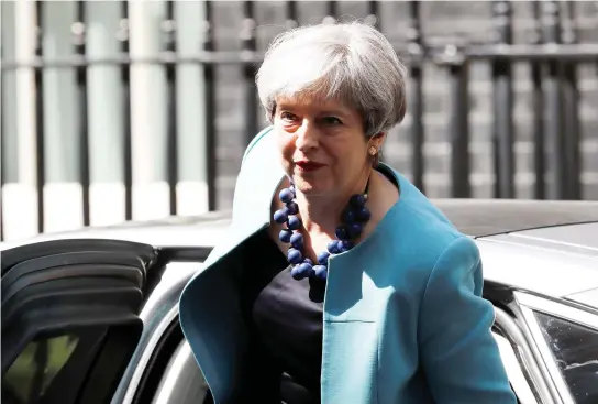  ??  ?? Britain’s Prime Minister, Theresa May, arrives in Downing Street in central London on Wednesday. (Reuters)