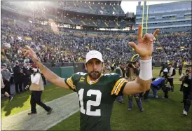  ?? MIKE ROEMER — THE ASSOCIATED PRESS ?? Packers’ Aaron Rodgers responds to fans after the team’s 42-24win over the Raiders last Sunday in Green Bay, Wis.