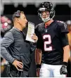  ?? CURTIS COMPTON / CCOMPTON@AJC.COM ?? QB Matt Ryan, conferring with offensive coordinato­r Steve Sarkisian, says getting the running game moving will be key to reviving the offense.