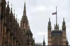  ?? —AFP ?? LONDON: A Union flag flies at half-mast from a flagpole above the Houses of Parliament in London yesterday, as a mark of respect to those killed and injured in the terror attack at the Ariana Grande concert at the Manchester Arena in Manchester.