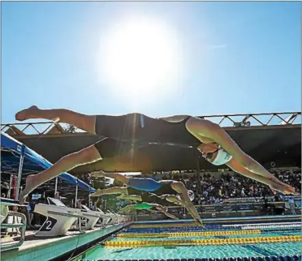  ?? COURTESY USA SWIMMING ?? Former Octorara High School swimmer Cierra Runge dives off the starting block at the U.S. Olympic Trials in Omaha, Neb., in early July.