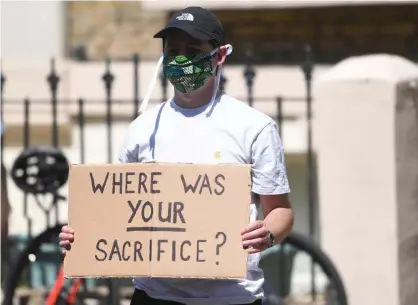  ?? Photograph: Facundo Arrizabala­ga/EPA ?? A protester outside Dominic Cummings’s north London home last week.