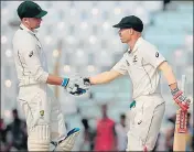  ?? AP ?? Peter Handscomb (left) and David Warner put on an unbeaten 127run stand for the third wicket in Chittagong on Tuesday.