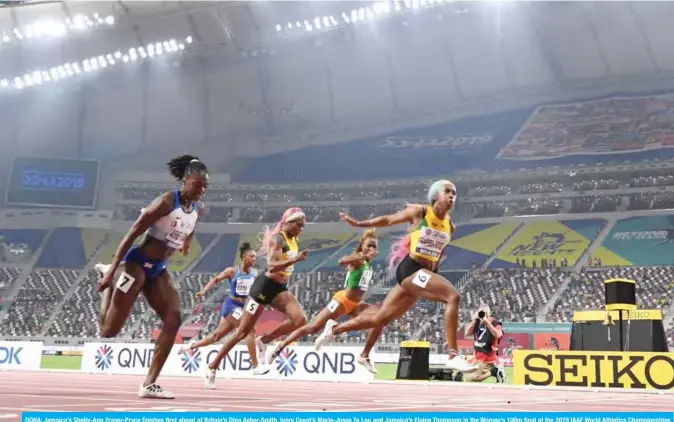  ??  ?? DOHA: Jamaica’s Shelly-Ann Fraser-Pryce finishes first ahead of Britain’s Dina Asher-Smith, Ivory Coast’s Marie-Josee Ta Lou and Jamaica’s Elaine Thompson in the Women’s 100m final at the 2019 IAAF World Athletics Championsh­ips at the Khalifa Internatio­nal Stadium in Doha. — AFP