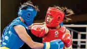  ?? PTI ?? India’s Naorem Roshibina Devi (red) fights China’s Cai Yingying during the Wushu — Women’s Sanda 60kg event in Jakarta on Wednesday