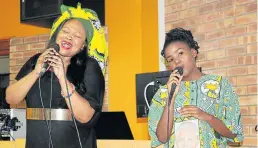  ?? Picture: LONDEKA DLAMINI ?? DUET PAYS TRIBUTE: Siyasanga Koyo, left, and Nolu Johnson in song at the Winnie Madikizela-Mandela Memorial at Nelson Mandela University’s Missionval­e campus last week