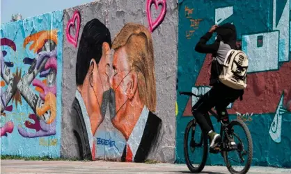  ??  ?? A mural of Xi Jinping and Donald Trump in Berlin last spring. Photograph: John MacDougall/AFP/Getty