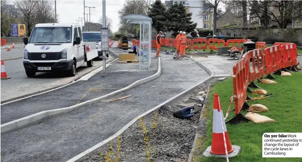  ??  ?? On yer bike Work continued yesterday to change the layout of the cycle lanes in Cambuslang