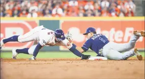  ?? DIRK SHADD / TNS ?? The Astros’ George steals second base as Rays shortstop Willy Adames is late with the tag in the third inning of Houston’s 62 victory in Game 1 of the ALDS on Friday.