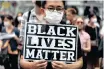  ?? | REUTERS ?? A DEMONSTRAT­OR holds a placard during a Black Lives Matter protest in Tokyo, Japan, yesterday.