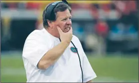  ?? AP/JOHN RAOUX ?? Florida head coach Jim McElwain walks the sideline during Saturday’s game against Georgia in Jacksonvil­le, Fla. Georgia won 42-7.