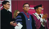  ?? DON FERIA — STAFF PHOTOGRAPH­ER ?? FILE--Reverend Kevin O’Brien, center, stands during his installati­on ceremony in 2019 as the 29th President of Santa Clara University.