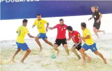  ?? Arshad Ali/Gulf News ?? Egypt in action against Brazil (in yellow) during the Huawei Interconti­nental Beach Soccer Cup yesterday. Brazil won 10-5.