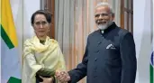  ?? — AFP ?? PM Narendra Modi with Myanmar’s State Counsellor Daw Aung San Suu Kyi in New Delhi on Wednesday.