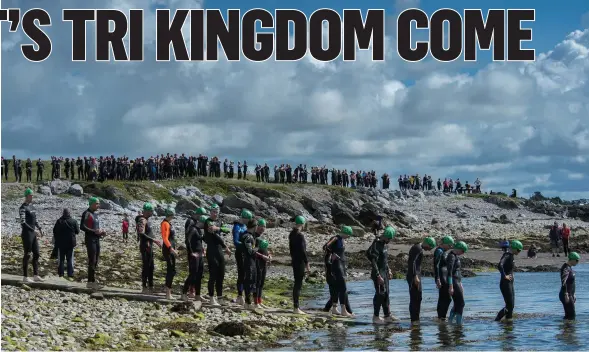  ?? Photo by Stephen Kelleghan. ?? Triathlete­s brace themselves as they enter the water for the start of the Tri Kingdom Triathlon in Fenit on Saturday morning.