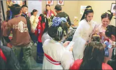  ?? PHOTOS PROVIDED TO CHINA DAILY ?? From left: The Hanfu Cultural Festival held in the ancient scenic town of Xitang, Zhejiang province; Chen Suyue (right) at the festival.