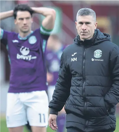  ?? ?? Joe Newell looks on as Hibs players and manager swallow another poor result