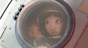  ?? NETFLIX ?? A young girl (voiced by Cathy Ang) builds a rocket ship and travels to space with her brother (Robert G. Chiu) in “Over the Moon.”