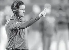  ?? JOHN RAOUX/AP ?? Hurricanes coach Manny Diaz signals to his players during the Cheez-it Bowl against Oklahoma State in Orlando.