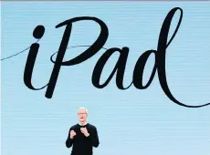  ?? JIM YOUNG/AFP/GETTY IMAGES ?? Apple CEO Tim Cook stressed the company’s commitment to education as it unveiled its 9.7-inch iPad in Chicago.
