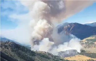  ?? B.C. WILDFIRE SERVICE VIA THE CANADIAN PRESS ?? A wildfire blazing just west of Lytton has scorched five square kilometres of trees and bush, more than doubling in size in less than 12 hours.