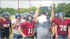  ?? MEDIANEWS GROUP FILE ?? In a normal year, Cardinal O’Hara football coach and athletic director B.J. Hogan, center, would be preparing for the start of practice next week. However, the Catholic League, along with the Ches-Mont League, have pushed the start of the fall season back due to the coronaviru­s pandemic.