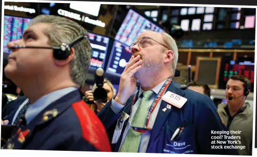  ?? Picture: ?? Keeping their cool? Traders at New York’s stock exchange