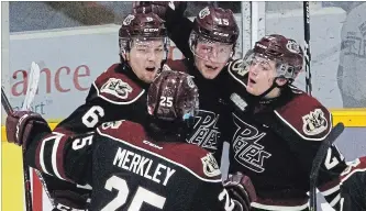  ?? CLIFFORD SKARSTEDT EXAMINER ?? Peterborou­gh Petes' Brady Hinz celebrates his goal with teammates Nick Isaacson, Austin Osmanski and Ryan Merkley scored on Mississaug­a Steelheads goalie Jacob Ingham during OHL action Jan. 3 at the Memorial Centre. With the OHL trade deadline looming, Merkley has been the only acquisitio­n so far by the Petes.