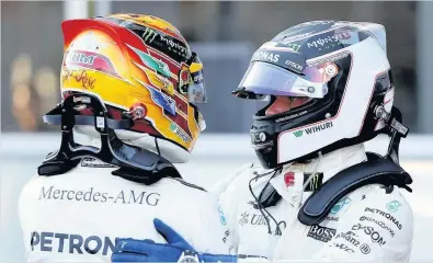  ??  ?? Top two qualifiers and team-mates Lewis Hamilton of Great Britain and Mercedes GP and Valtteri Bottas