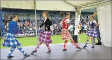  ??  ?? The girls compete in the Highland dancing.