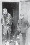  ?? Associated Press ?? In this 1926 file photo, Norwegian explorer Roald Amundsen, left, stands with Lt. Undahl, who was his pilot in the attempt to fly over the North Pole, at the doorway to his hut on the Arctic ice. In 1903, Amundsen and six other men set out in a tiny...