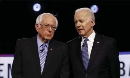  ?? Photograph: Matt Rourke/AP ?? Bernie Sanders and Joe Biden at a Democratic presidenti­al primary debate in February 2020.