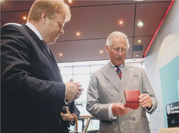  ?? ?? Then Prince Charles (above) visiting Royal Mint in 2017
The Queen's image on stamps (right) will eventually be replaced by King Charles III (photos: Getty)