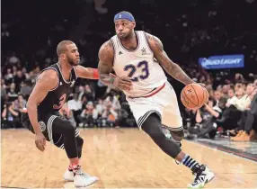  ??  ?? LeBron James drives against Chris Paul during the 2015 NBA All-Star Game at Madison Square Garden. BOB DONNAN/USA TODAY SPORTS