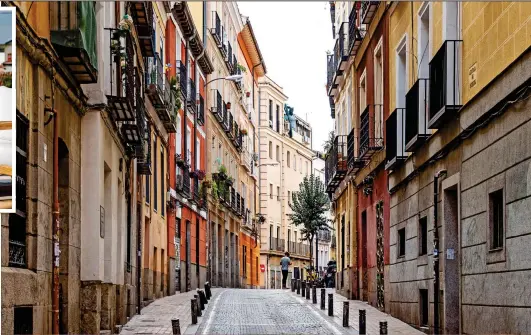  ?? ?? BOHEMIAN: The stylish Malasana district, above. Top left: The rooftop bar at Ocean Drive Madrid